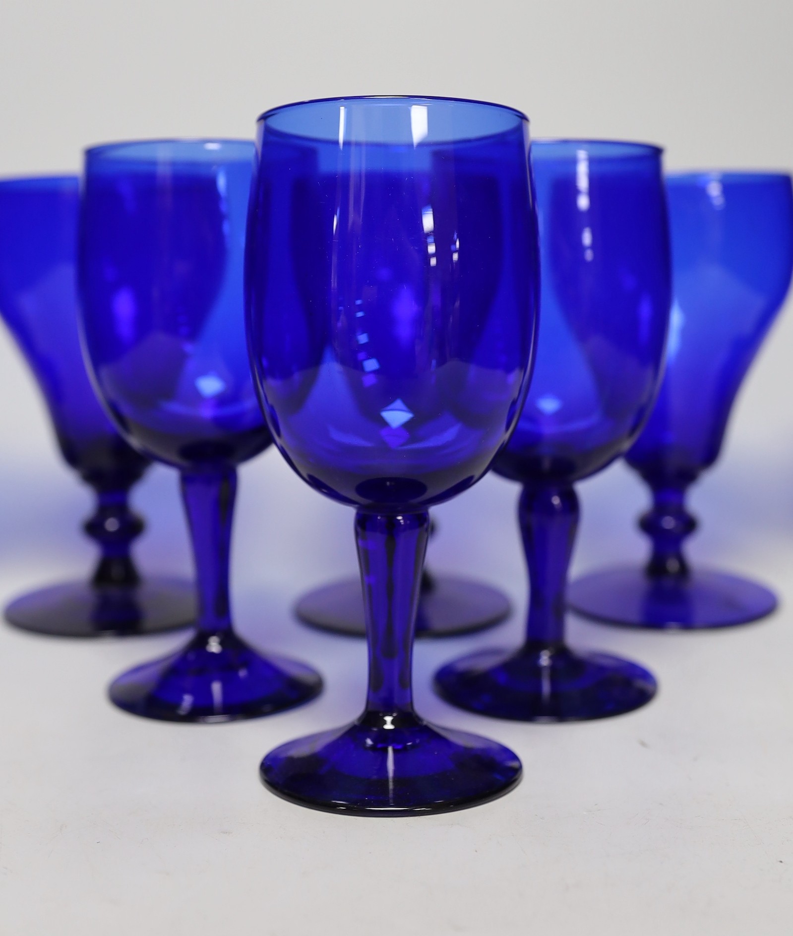 A set of five Bristol blue glasses and three others